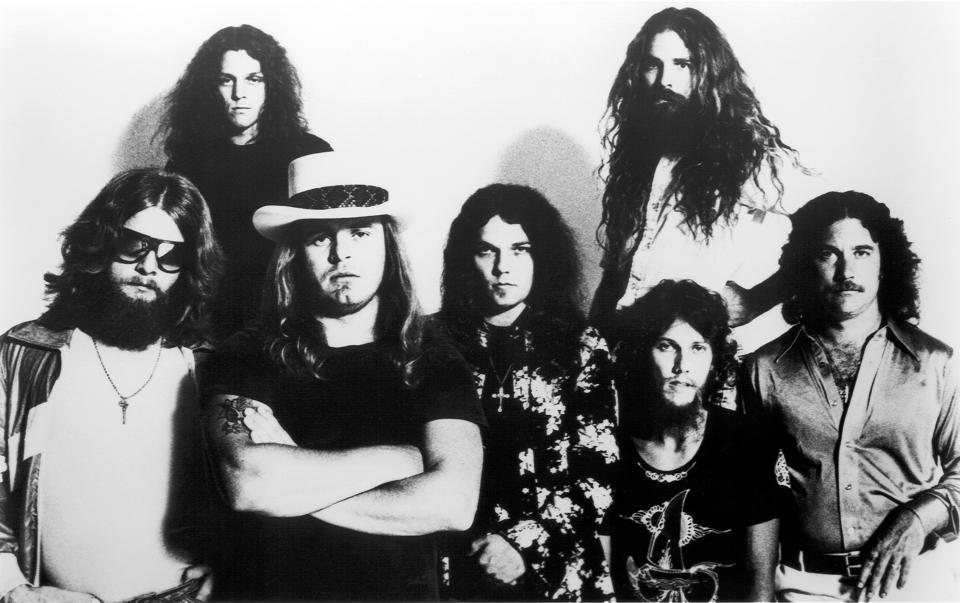 Leon Wilkeson, Allen Collins, Gary Rossington, Artimus Pyle {top}, Steve Gaines and Billy Powell in black and white portrait