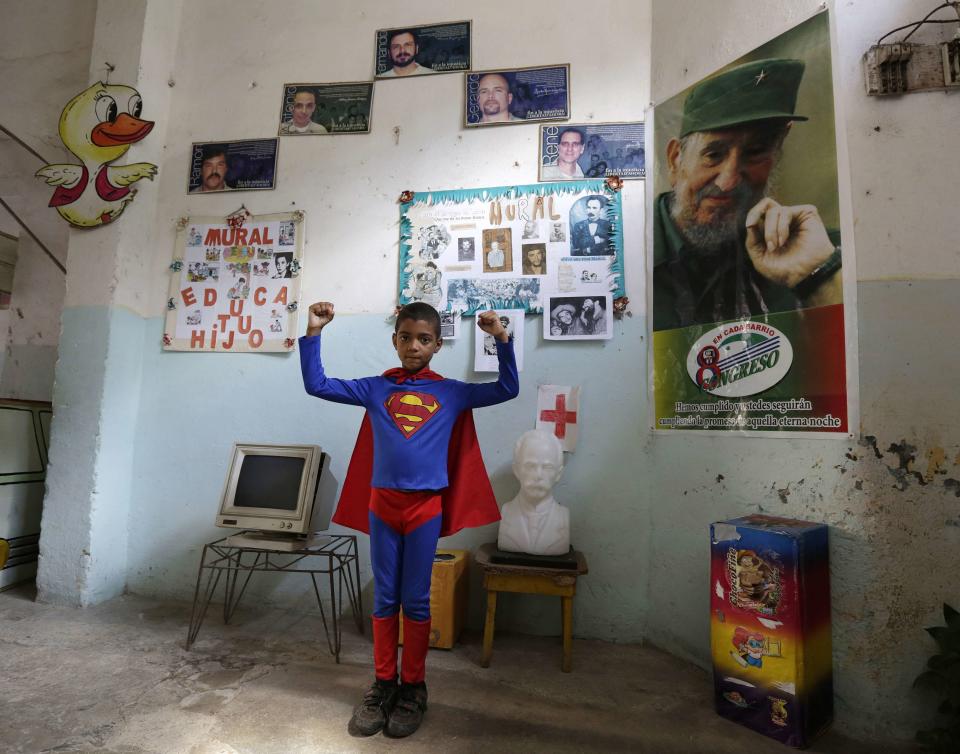 Second grade student at the Enrique Villuendas Primary School, Suilber Cuesta, poses in his Superman costume in Havana