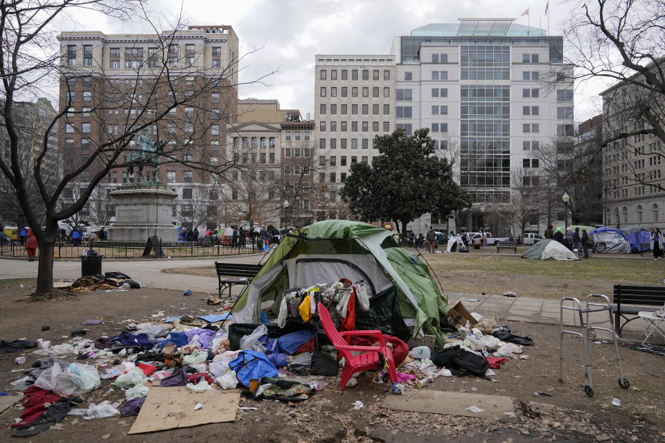 A tent and debris sit in McPherson Square in Washington, Wednesday, Feb. 15, 2023, prior to being cleared by the National Park Service. (AP Photo/Patrick Semansky)