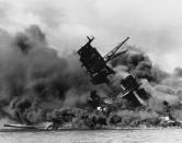 <p>The forward superstructure of the sunken battleship USS Arizona burns after the Japanese raid on Pearl Harbor on Dec. 7, 1941. (U.S. Navy/U.S. Naval History and Heritage Command/Handout via Reuters) </p>