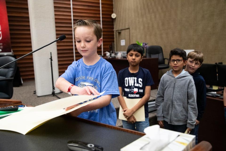 Windsor Park third grade student Barrett Ocker stands on a stool at a podium and prepares to debate the pros of community gardens on Tuesday, Oct. 24, 2023, in Corpus Christi, Texas.