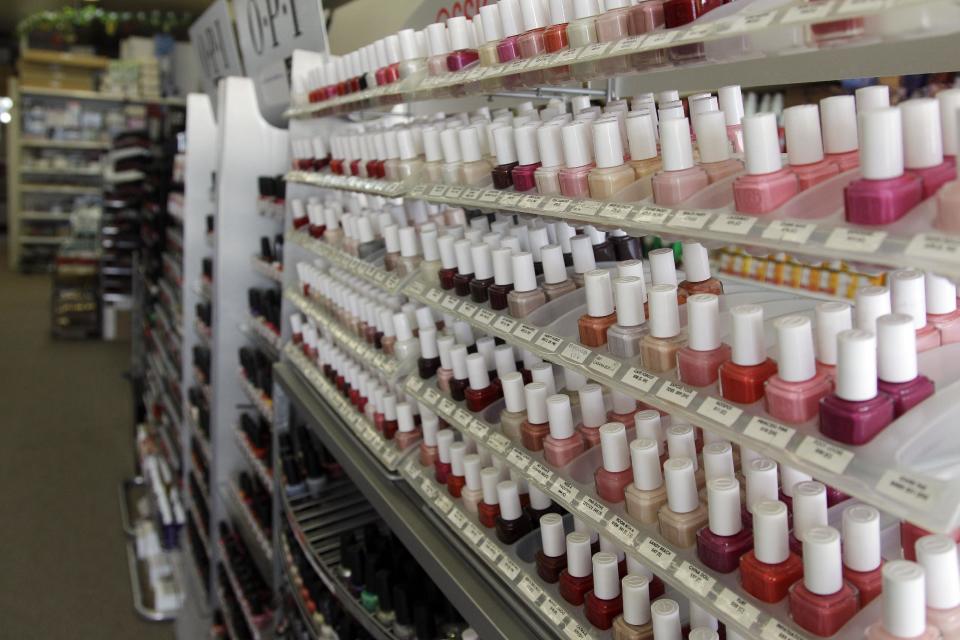 Nail care products are displayed at a beauty supply shop in San Francisco, Monday, April 9, 2012. California’s chemical regulators randomly sampled dozens of professional grade nail polishes that claimed to be free of a "toxic trio" of dangerous substances and found that many still contained the chemicals in high levels. (AP Photo/Marcio Jose Sanchez)