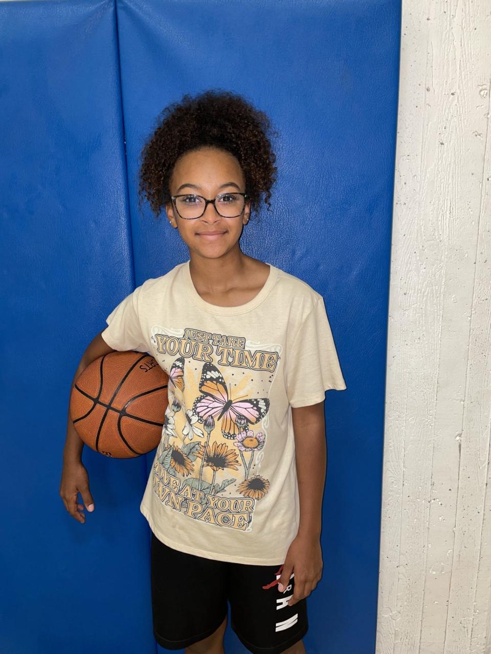 Bay Trail student Saniyya Willis is one of many happy campers. This was her second time attending the annual Thomas Bryant Basketball Camp.