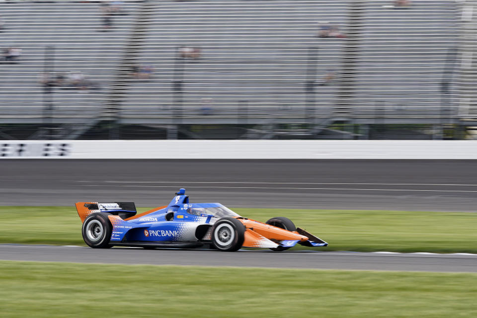 Scott Dixon, of New Zealand, drives into a turn during practice for the IndyCar Grand Prix auto race at Indianapolis Motor Speedway, Friday, May 12, 2023, in Indianapolis. (AP Photo/Darron Cummings)