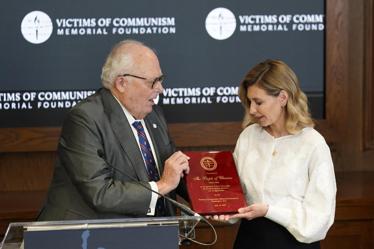 Olena Zelenska, spouse of Ukrainian's President Volodymyr Zelenskyy, accepts the Dissident Human Rights Award on behalf of the people of Ukraine for their brave fight against Russia from Dr. Edwin Feulner chairman of the Victims of Communism Memorial Foundation, at the Victims of Communism Museum in Washington, Tuesday, July 19, 2022. (AP Photo/Carolyn Kaster)