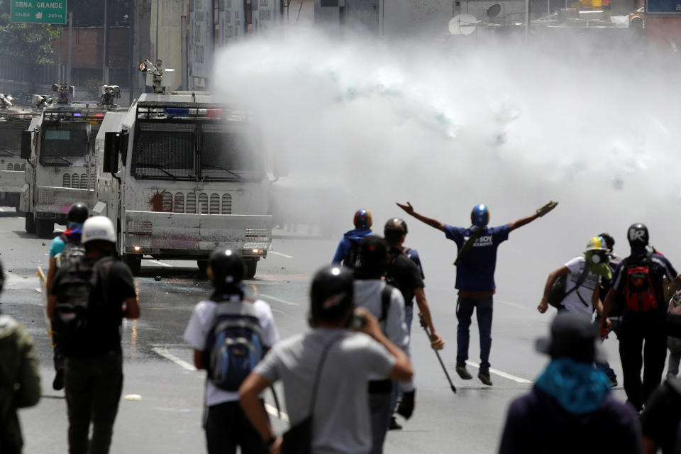 <p>A jet of water is released on demonstrators during a rally against Venezuela’s President Nicolas Maduro in Caracas, Venezuela, May 26, 2017. (Marco Bello/Reuters) </p>