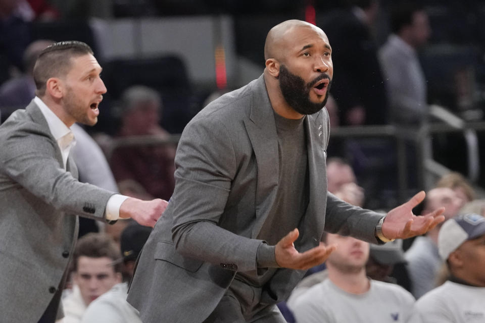 Villanova head coach Kyle Neptune, right, reacts during the first half of an NCAA college basketball game against Marquette in the quarterfinal round of the Big East Conference tournament, Thursday, March 14, 2024, in New York. (AP Photo/Mary Altaffer)