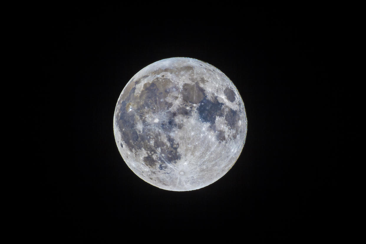 The March 5 _mini-Moon,î the apogee Moon, the most distant Full Moon of 2015. I processed this image with greatly enhanced vibrance, saturation and contrast to exaggerate the subtle differences in colour in the lunar maria, due to differences in the mineral content of the lava flows that formed the mare ~3.5 to 4 billion years ago. The relatively new impact crater, Tycho, is the bright area at bottom (south) on the luanr disk with bright splash rays emanating from the crater. I shot this with a TMB 92mm refractor with a 2x Barlow lens for an effective f-ratio of about f/12. This is a 1/125th second exposure at ISO100 with the Canon 60Da. (Photo by: Alan Dyer /VW PICS/Universal Images Group via Getty Images)