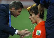 Daryl Janmaat of the Netherlands receives medical attention after being injured by Argentina's Marcos Rojo (not pictured) during their 2014 World Cup semi-finals at the Corinthians arena in Sao Paulo July 9, 2014. REUTERS/Sergio Moraes (BRAZIL - Tags: SOCCER SPORT WORLD CUP)