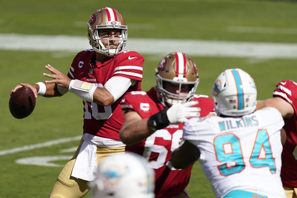 San Francisco 49ers quarterback Jimmy Garoppolo (10) passes against the Miami Dolphins during the first half of an NFL football game in Santa Clara, Calif., Sunday, Oct. 11, 2020. (AP Photo/Tony Avelar)