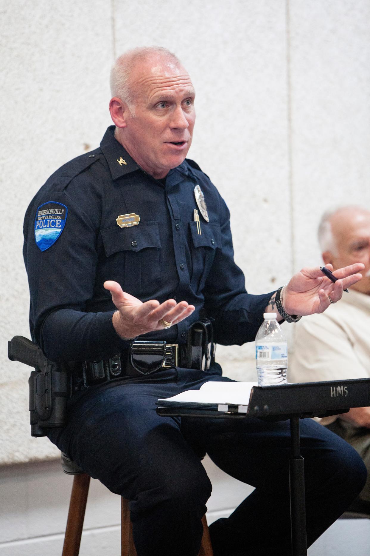 Hendersonville Police Chief Blair Myhand talks with people who attended a meeting in 2021 about forming a citizen's group.