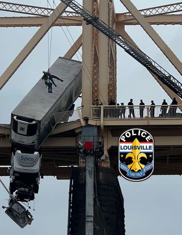 <p>Louisville Metro Police Department/Facebook</p> Semi truck over the side of a bridge in Louisville, Ky.