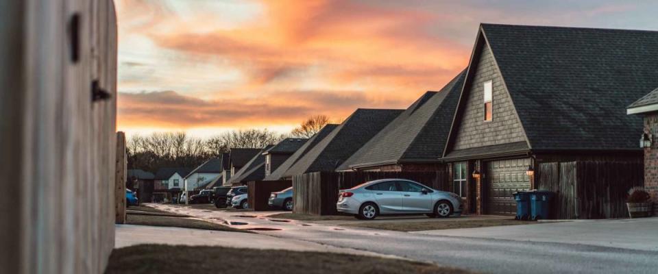 Living in Residential Housing Neighborhood Street at Sunset in Bentonville Arkansas