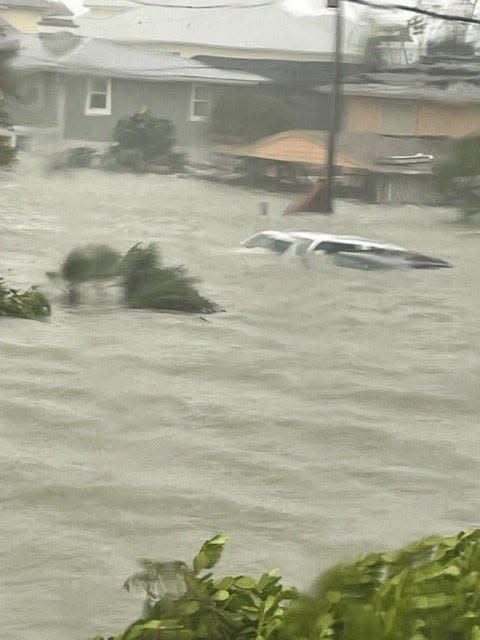 Fort Myers Beach resident Matt Oakley took this photo of his Dodge Caravan right before it floated away in the storm surge created by Hurricane Ian on Sept. 28, 2022. "No movie compares," Oakley said.