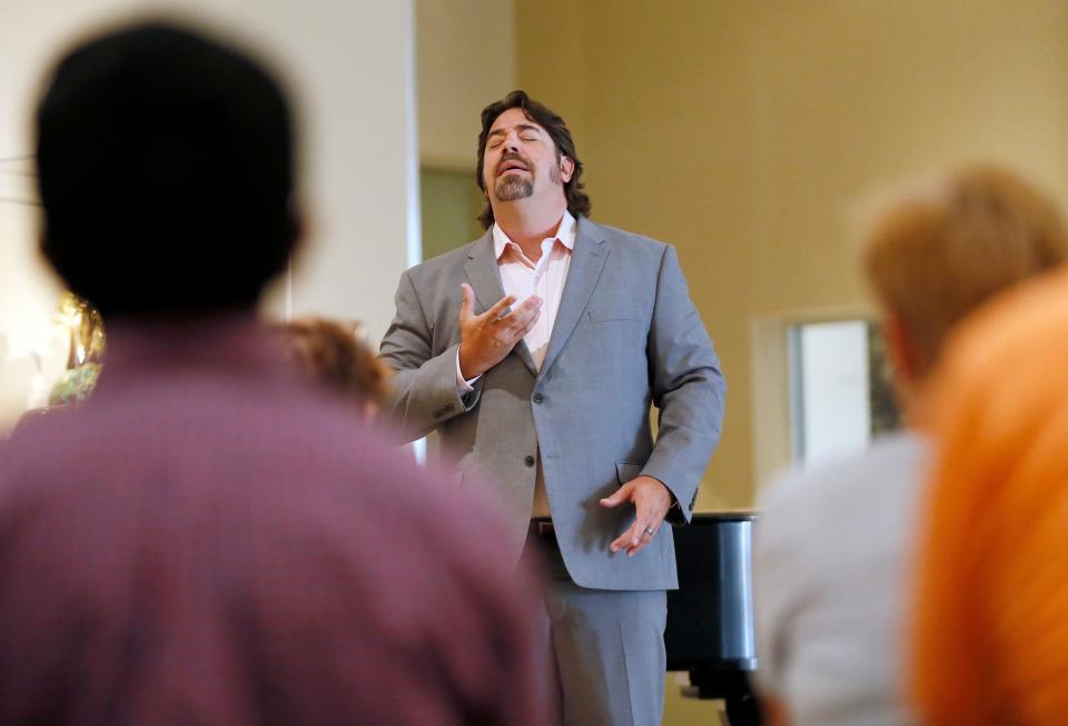 Joel Burcham, tenor, sings during a performance by Painted Sky Opera at the Oklahoma City Museum of Art in Oklahoma City, Wednesday, July 26, 2017. He will play the lead role of a killer clown in Painted Sky's June 11 production of "Pagliacci."
