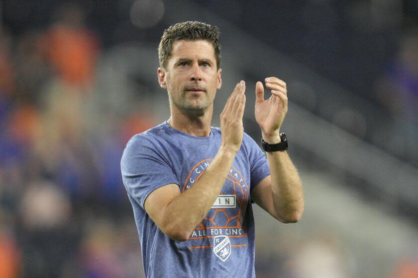 FC Cincinnati head coach Pat Noonan applauds to the crowd following the team's MLS soccer match.