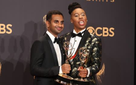 69th Primetime Emmy Awards – Photo Room – Los Angeles, California, U.S., 17/09/2017 - Aziz Ansari (L) and Lena Waithe pose with the Emmy for Outstanding Writing for a Comedy Series for Master of None. REUTERS/Lucy Nicholson