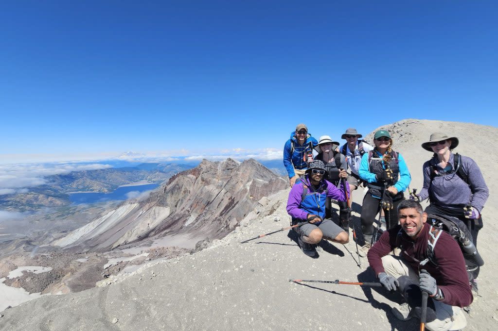 Colt Peeters, retail guide at Cotopaxi, and a group of hikers at Mount St. Helens in Washington State.