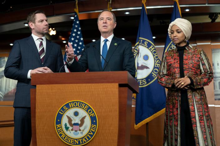 Rep. Adam Schiff, D-Calif., center, with Rep. Eric Swalwell, D-Calif., left, and Rep. Ilhan Omar, D-Minn., speaks during a news conference on Capitol Hill in Washington, Wednesday, Jan. 25, 2023, in Washington.