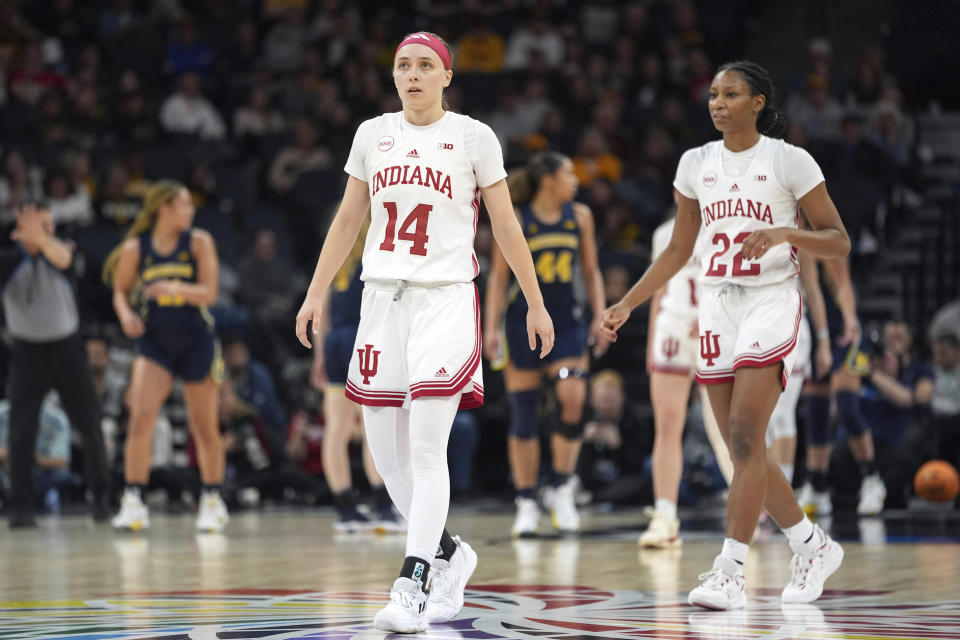 Indiana guard Sara Scalia (14) walks down the court during the first half of an NCAA college basketball quarterfinal game against Michigan at the Big Ten women's tournament Friday, March 8, 2024, in Minneapolis. (AP Photo/Abbie Parr)