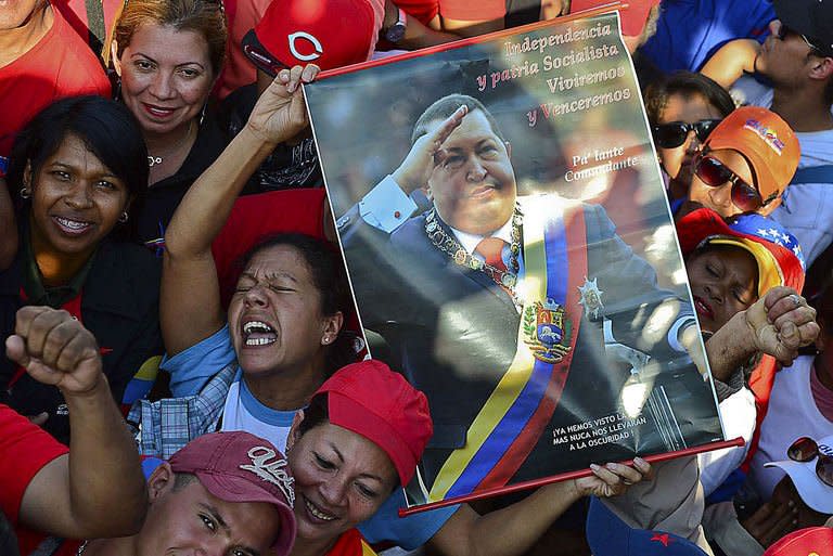 Supporters of the late President Hugo Chavez are seen outside his funeral in Caracas, on March 8, 2013