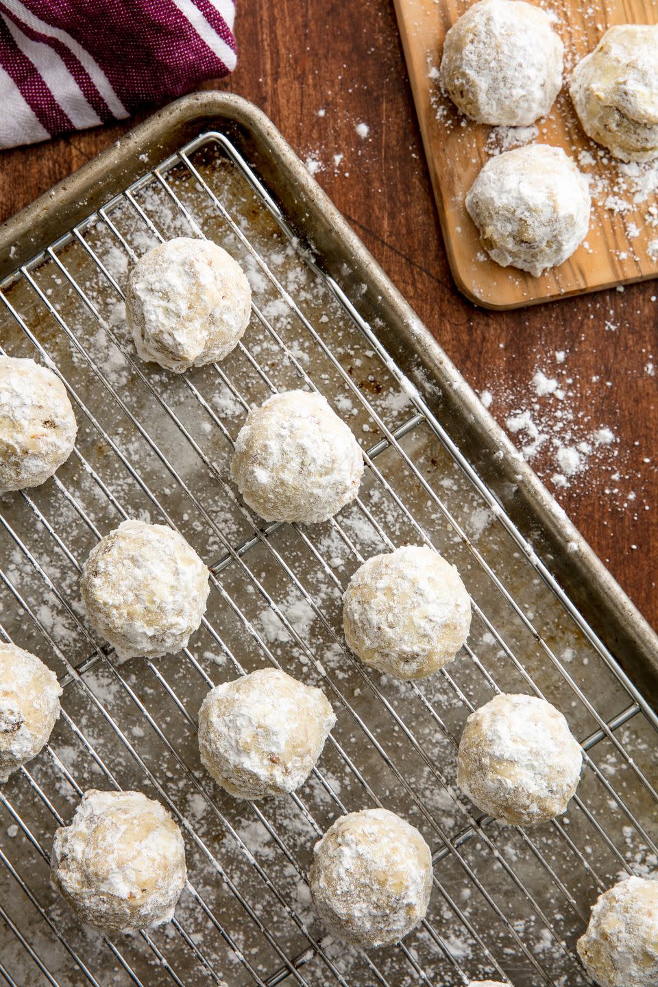 <p>Fair warning: the powdery confectioner's sugar that makes these snowballs "snowy" and delicious <em>can</em> end up dousing you in sugar with every bite, so make sure you have napkins ready and eat them over a plate to catch the winter wonderland. We should also say that this mess is <em>totally</em> worth it for these nutty sweet <a href="http://www.delish.com/holiday-recipes/christmas/g2177/easy-christmas-cookies/" rel="nofollow noopener" target="_blank" data-ylk="slk:cookies;elm:context_link;itc:0;sec:content-canvas" class="link ">cookies</a>, and they couldn't be easier to make.</p><p>Get the <strong><a href="https://www.delish.com/cooking/recipe-ideas/recipes/a56364/best-snowball-cookies-recipe/" rel="nofollow noopener" target="_blank" data-ylk="slk:Snowball Cookies recipe;elm:context_link;itc:0;sec:content-canvas" class="link ">Snowball Cookies recipe</a></strong>.</p>