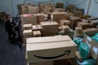 An employee prepares an order for Amazon at Porona warehouse in Bruay-sur-l'Escaut