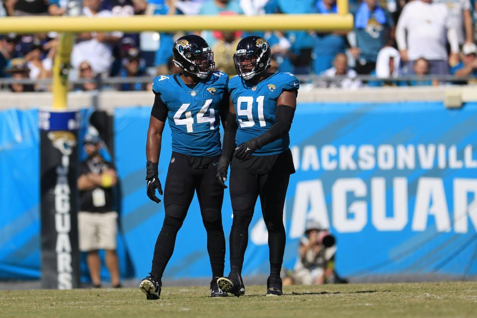 Jacksonville Jaguars linebacker Travon Walker (44) and defensive end Dawuane Smoot (91) talk after Walker picked up a penalty during the fourth quarter of an NFL football game Sunday, Oct. 9, 2022 at TIAA Bank Field in Jacksonville. The Houston Texans defeated the Jacksonville Jaguars 13-6. [Corey Perrine/Florida Times-Union]