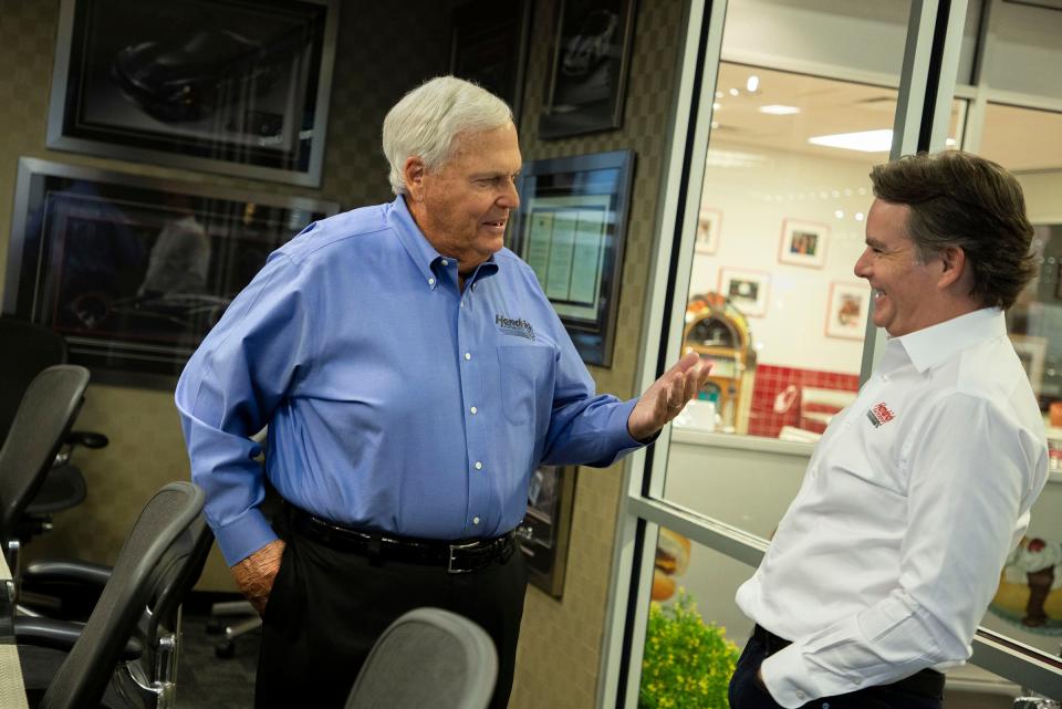 Rick Hendrick, left, and legendary driver and vice chairman of Hendrick Motorsports, Jeff Gordon, talk with each other about the business while inside the 58,000-square-foot Heritage Center in Concord, North Carolina, on July 25, 2023.