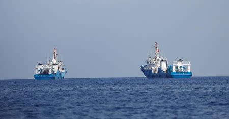 Chinese vessels are pictured at the disputed Scarborough Shoal April 6, 2017. REUTERS/Erik De Castro