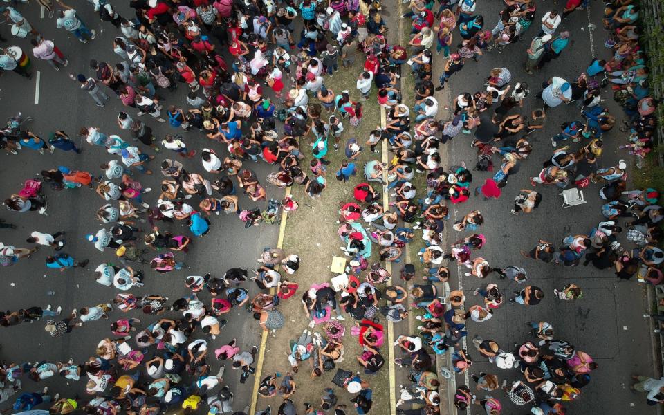 People march in a protest demanding new measures to face the economic deterioration of families in the midst of the second wave of covid-19 pandemic, in Buenos Aires - JUAN IGNACIO RONCORONI/EPA-EFE/Shutterstock