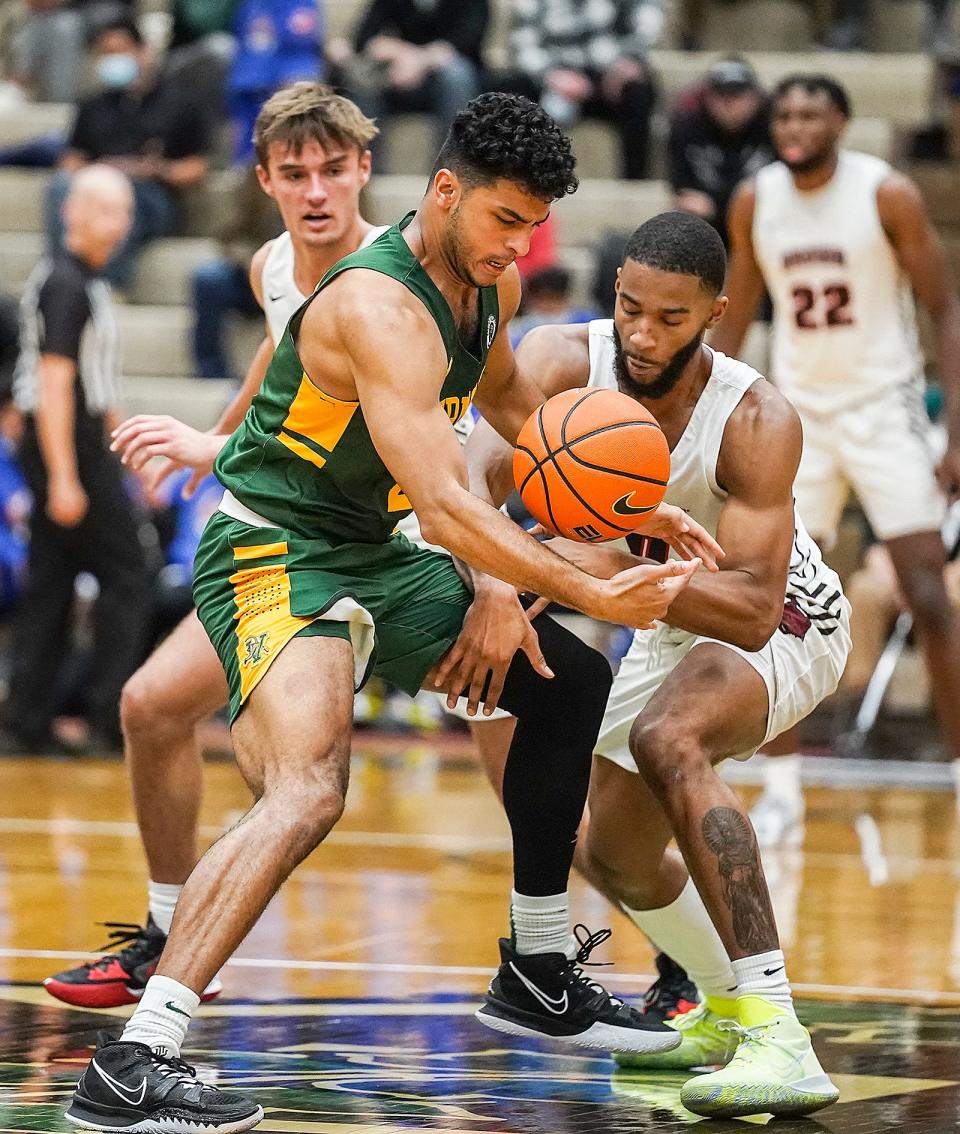 Vermont’s Justin Mazzulla gains control of a loose ball in the second half as the Catamounts break the Bears' press. The Johnston native grabbed the ball before Brown’s David Mitchell could.