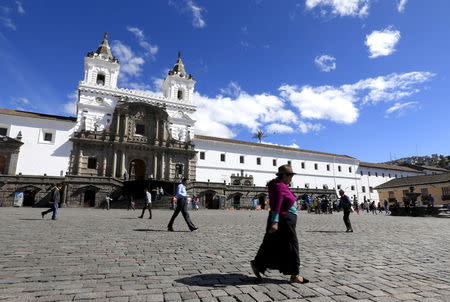 An Ecuador Indian walks in front of San Francisco square, where Pope Francis will give a mass during his upcoming visit to the country, in Quito, Ecuador July 4, 2015. REUTERS/Jose Miguel Gomez