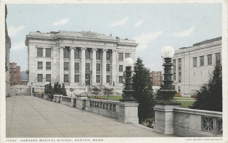 Postcard of large, neoclassical, stone building.