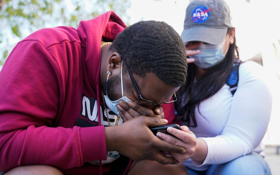 London Williams, 31, of Harrisburg, Pa., bursts into tears  - AP Photo/Jacquelyn Martin