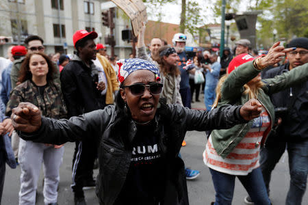 A conservative demonstrator chants towards a group of counter-demonstrators during a Patriots Day Free Speech Rally in Berkeley, California, U.S., April 15, 2017. REUTERS/Stephen Lam