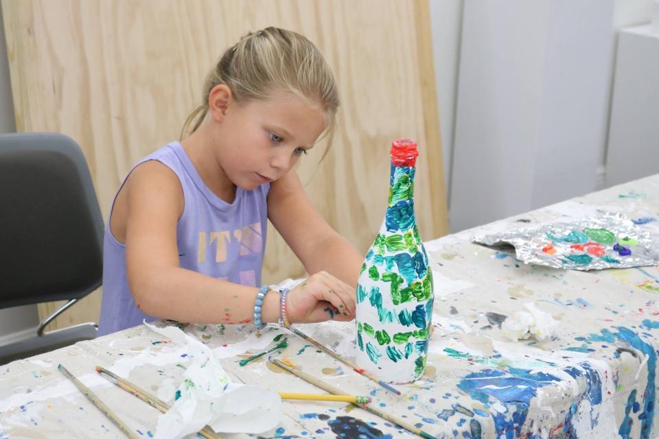 Lucy Cochran creates a piece of art during a summer  camp at the Kentuck Art Center in this 2018 file photo.  [Photo provided by Sydney Gruber]