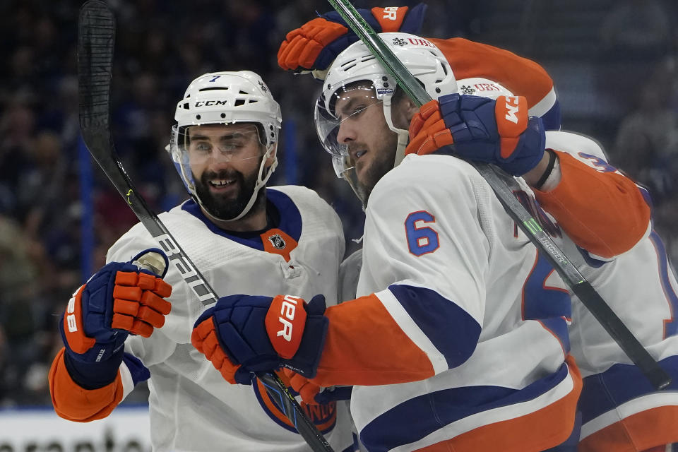 New York Islanders defenseman Ryan Pulock (6) celebrates his goal against the Tampa Bay Lightning with right wing Jordan Eberle (7) during the third period in Game 1 of an NHL hockey Stanley Cup semifinal playoff series Sunday, June 13, 2021, in Tampa, Fla. (AP Photo/Chris O'Meara)