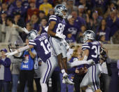 Kansas State wide receiver Phillip Brooks (88) celebrates with wide reciever Landry Weber (12) and fullback Ben Sinnott (34) after scoring a touchdown against Iowa State during an NCAA football on Saturday, Oct. 16, 2021, in Manhattan, Kan. (AP Photo/Colin E. Braley)