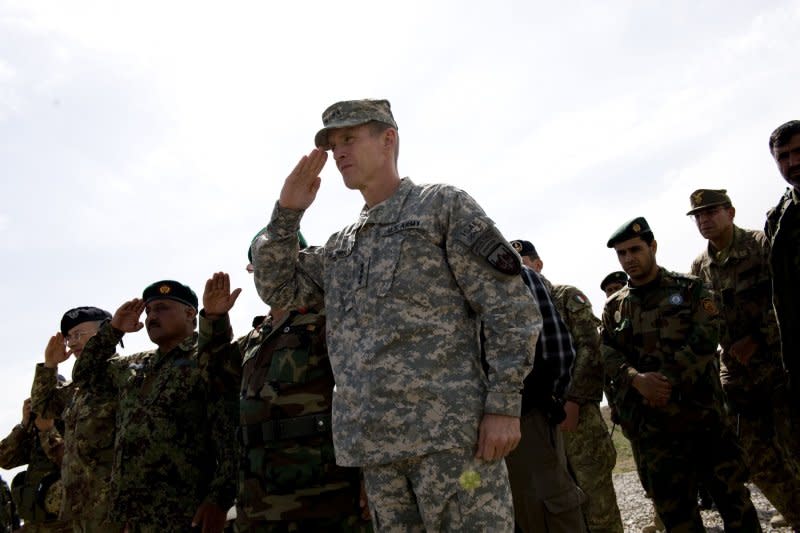 Gen. Stanley McChrystal inspects a guard of honor during ceremony at an aviation base for Afghan National Army in Herat, Afghanistan, on March 25, 2010. On June 23, 2010, McChrystal resigned as commander of U.S. and NATO troops in Afghanistan after he and senior aides made disparaging remarks in a magazine interview about administration officials. File Photo by Hossein Fatemi/UPI