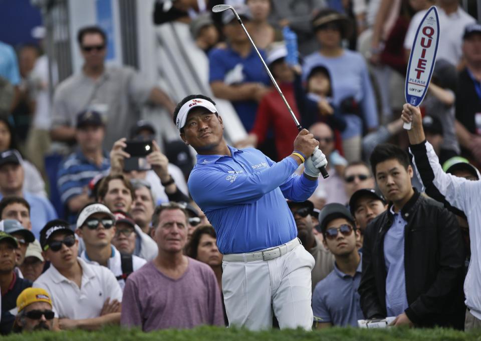 K.J. Choi looks skyward after hitting a high flop shot from the rough adjacent the 17th green on the South Course during the final round of the Farmers Insurance Open golf tournament Sunday, Jan. 26, 2014, in San Diego. Choi finished the tournament at 8-under-par. (AP Photo/Lenny Ignelzi)