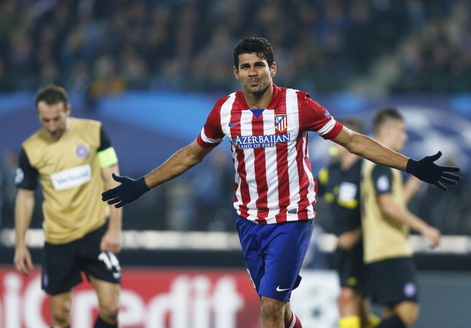 Atletico Madrid's Diego Costa celebrates after scoring a goal against Austria Vienna during their Champions League Group G soccer match in Vienna October 22, 2013. REUTERS/Dominic Ebenbichler (AUSTRIA - Tags: SPORT SOCCER)