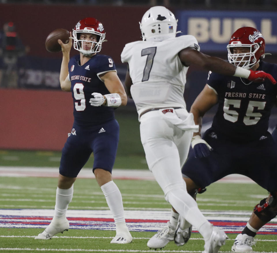 Fresno State quarterback Jake Haener drops back to pass against UNLV during the first half of an NCAA college football game in Fresno, Calif., Friday, Sept. 24, 2021. (AP Photo/Gary Kazanjian)