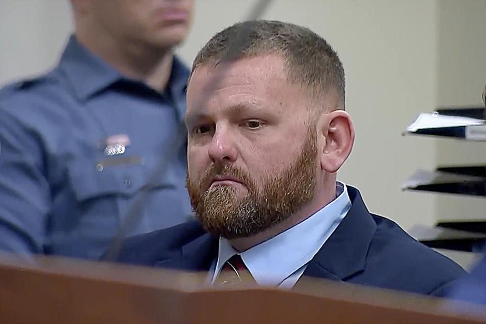 Colorado ex-police officer Randy Roedema listens during sentencing at the Adams County Court, Friday, Jan. 5, 2024, in Brighton, Colorado. Roedema was convicted of killing Elijah McClain, a young Black man walking home from a store, is expected to learn Friday whether a judge will sentence him to prison or he will receive probation. (ABC News One/Pool via AP)