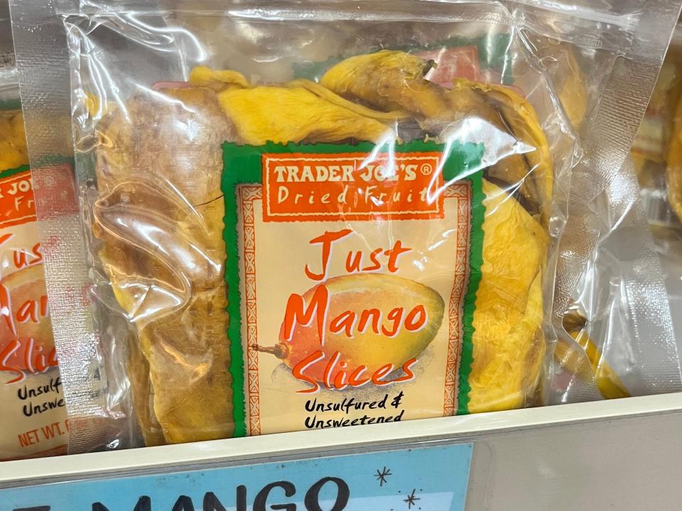 Trader Joe's just mango slides on display, with a price tag that reads $2.99.