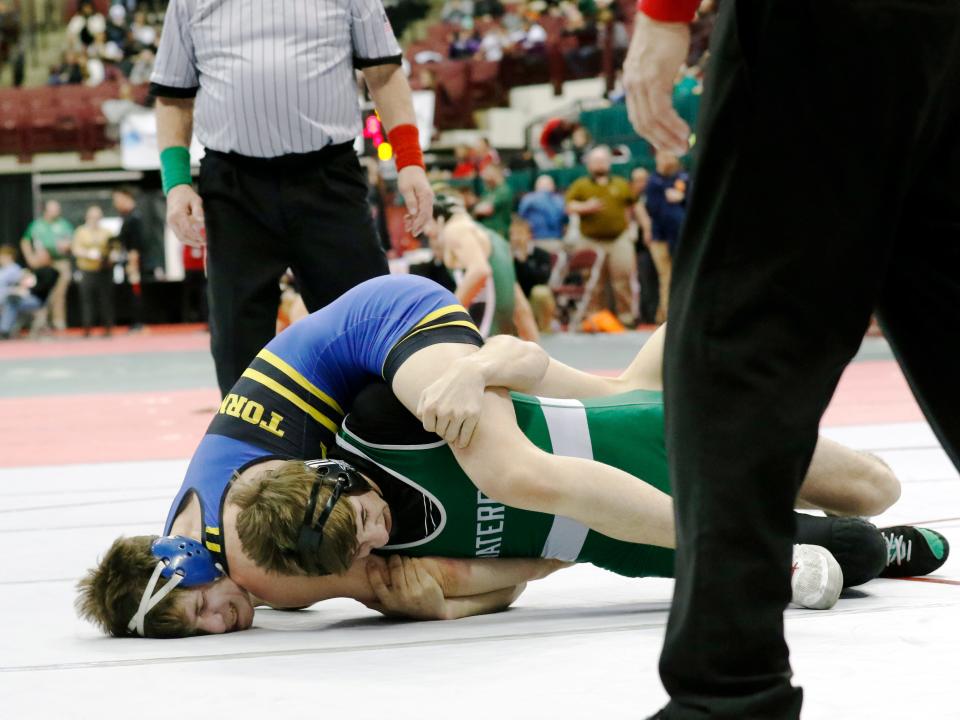 West Muskingum's Kaleb McFee, left, wrestles Waterford's Lane Cline during the Division II state tournament on Saturday, March 12, 2022, at Ohio State's Value City Arena. McFee will wrestle for seventh place on Sunday morning.