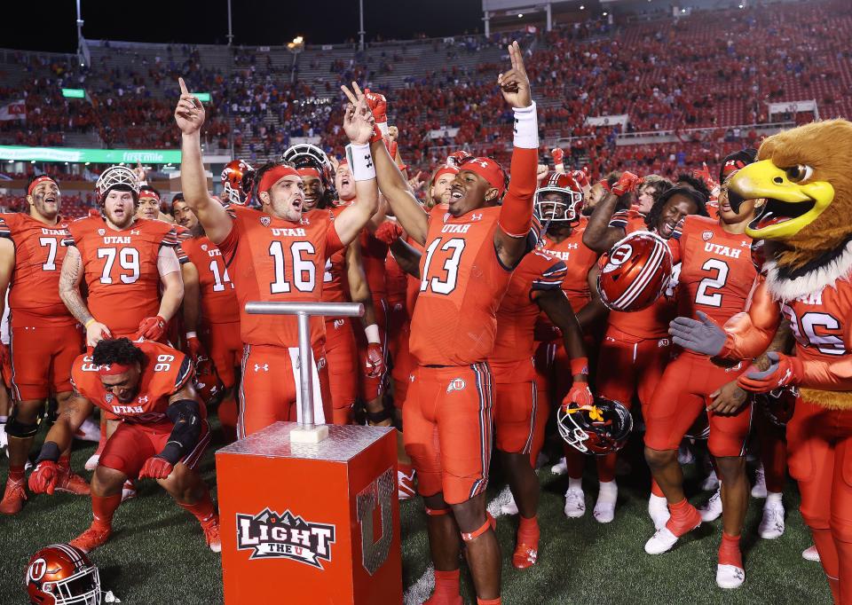 Utah Utes quarterback Bryson Barnes (16) and Utah Utes quarterback Nate Johnson (13) celebrate the Ute win over the Florida Gators in Salt Lake City on Thursday, Aug. 31, 2023 during the season opener. Utah won 24-11. | Jeffrey D. Allred, Deseret News