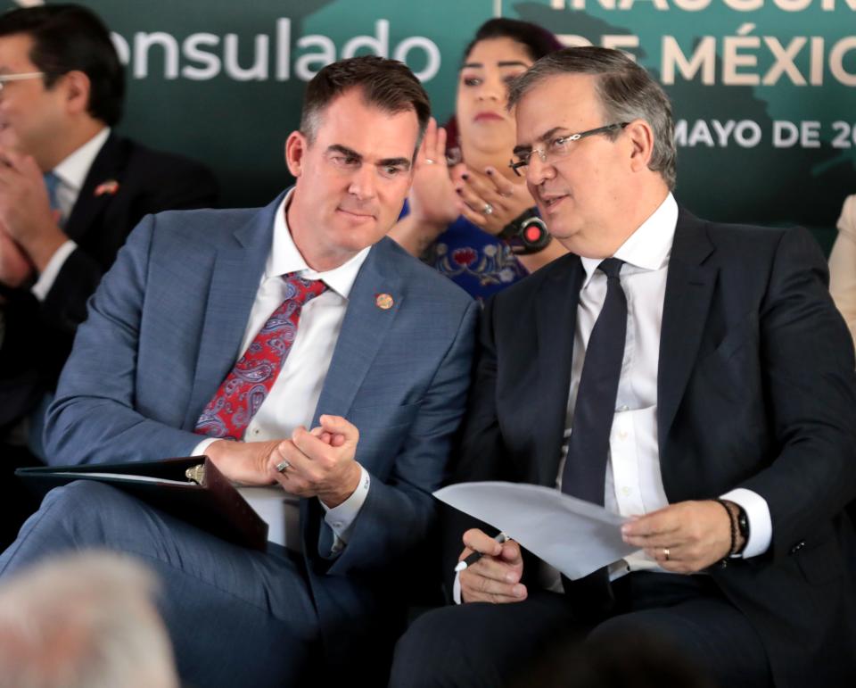 Gov. Kevin Stitt speaks with Minister of Foreign Affairs of Mexico Marcelo Ebrard on Saturday at the inauguration of Oklahoma City's Mexican consulate.
