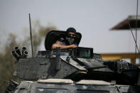 A member of the Iraqi Federal Police is seen on an armoured vehicle at the frontline in western Mosul, Iraq May 29, 2017. REUTERS/Alkis Konstantinidis