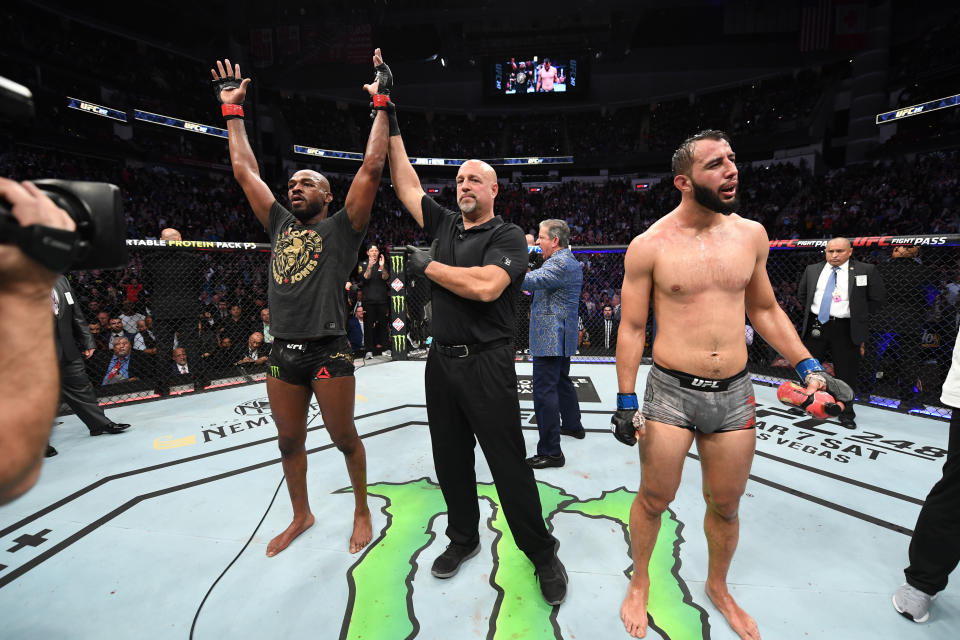 HOUSTON, TEXAS - FEBRUARY 08:  (L-R) Jon Jones celebrates his victory over Dominick Reyes in their light heavyweight championship bout during the UFC 247 event at Toyota Center on February 08, 2020 in Houston, Texas. (Photo by Josh Hedges/Zuffa LLC via Getty Images)